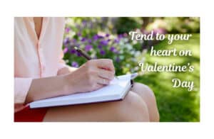 woman practicing self-care on Valentine's Day to nourish her Venus and relationship by writing in her journal